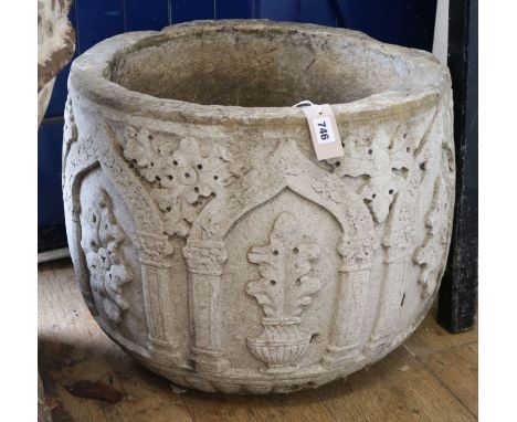 A circular reconstituted stone planter W.57cm