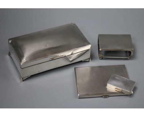 An engine turned silver cigarette case, a silver pill box, a silver matchbox sleeve and silver cigarette box (a.f.).