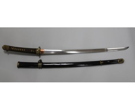 A Showa-To Samurai katana, with gilt brass mounts and bound shagreen grip and black lacquered scabbard, ex. Christie's Sale 9