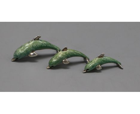 A modern graduated set of three Italian silver and enamel dolphins, largest 53mm.