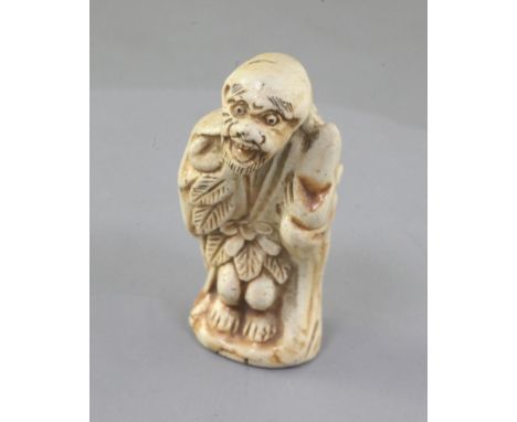 A Japanese porcelain netsuke a Sennin, 19th century, unsigned, 5.3cmProvenance: purchased from Bakers in November 1975.