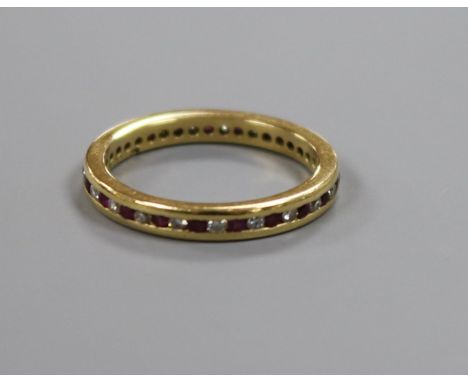 An 18ct gold, ruby and diamond full eternity ring, size M/N