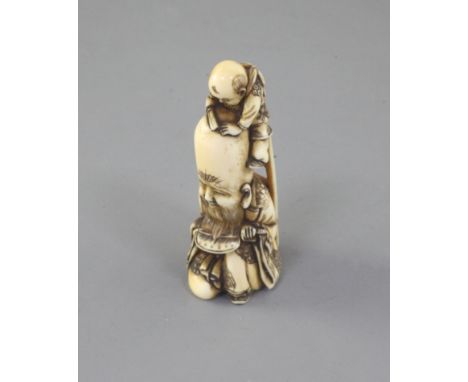 A Japanese ivory netsuke of Fukurokuju and a boy, 19th century, signed Minkoku, the boy at the top of a ladder and resting hi