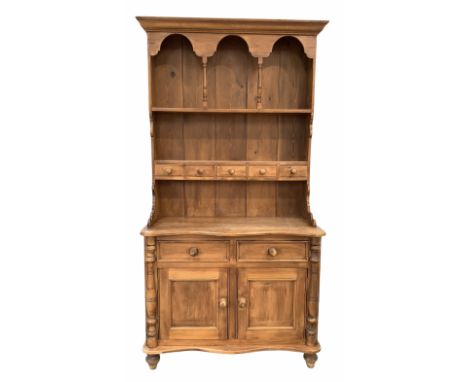Victorian style waxed pine dresser, two height plate rack fitted five spice draws over the base with serpentine top, two draw
