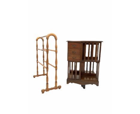 Mahogany two tier revolving bookcase, serpentine moulded top over three drawers and eight shelves with slatted sides, raised 