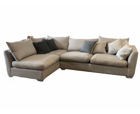 Large contemporary corner sofa, with squab cushions, upholstered in grey fabric, raised on chrome bracket supports 300cm x 19