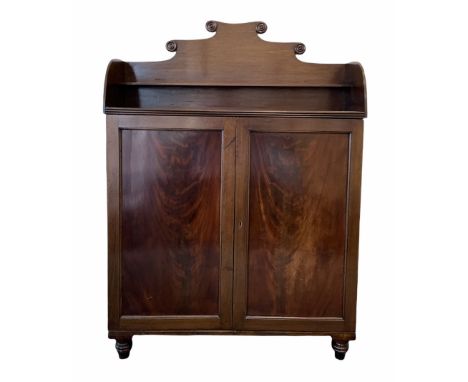 Mid 19th century Irish mahogany floor standing bookcase, the raised back with applied turned roundels and open shelf over two