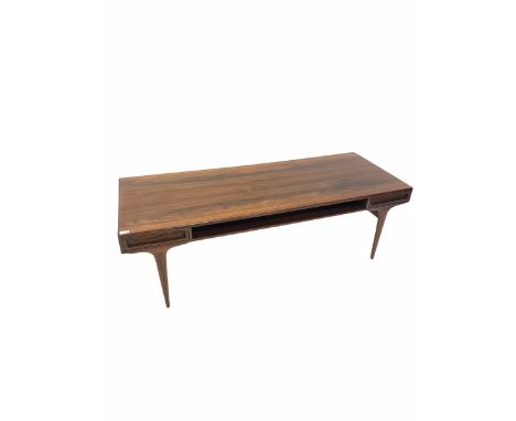 Danish mid-century dark wood coffee table, fitted with two drawers and a magazine shelf, raised on tapered supports, circa 19