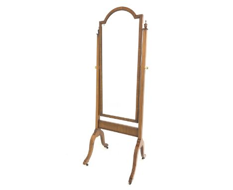 Georgian style walnut cheval dressing mirror, the swing mirror with stepped arched top on square tapered uprights with urn fi