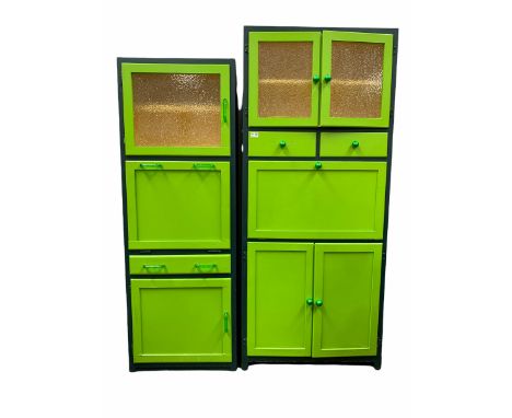 Vintage green painted kitchen cabinet, two glazed doors enclosing shelf over two drawers, a fall front cupboard and double cu