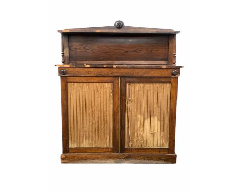 Late Georgian rosewood chiffonier, the raised back with open shelf over two pleated silk lined doors enclosing two shelves, r