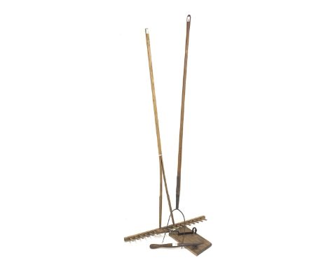 Long ash handled two pronged pitch fork, (L185cm) together with a landscaping rake (L175cm) a daisy picker, and a rustic wrou