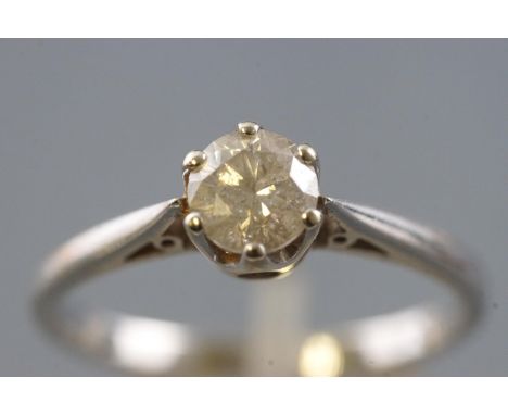 A white metal single stone ring, set with a round brilliant cut diamond, stamped weight of 0.75cts. Colour: K/L Clarity: I2/I