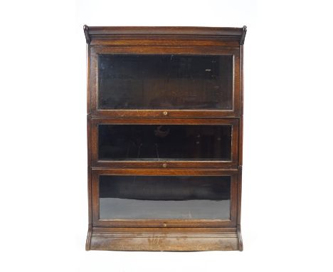 An oak Globe Wernicke style three section stacking bookcase, 123cm high x 87cm wide x 36cm deep