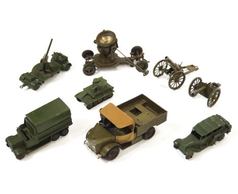 A group of eight Dinky army toys to include field guns and a search light