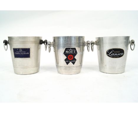Three champagne buckets, each with two ring handles and labelled Moet &amp; Chandon, Lanson and Charles Heidsieck, 20.5cm hig