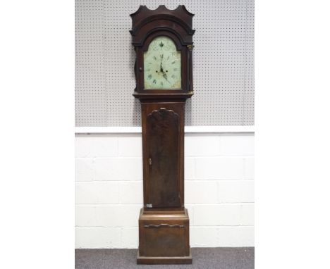 An 18th century mahogany long cased clock with enamel painted dial, decorated with a classical urn, hood flanked by Corinthia