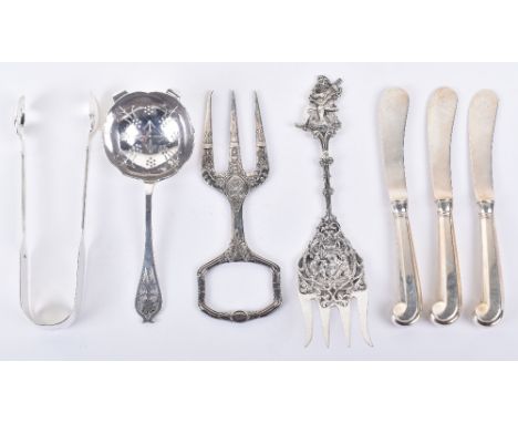 A mixed lot of silver including a pair of Victorian tongs, three butter knives, by C J Vander Ltd, London 1966, a Dutch decor