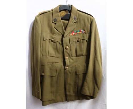 Army green khaki dress uniform jacket with interior breast pocket label "LT COL F J DOHERTY TD 9989 19.7.45" with Indian Medi