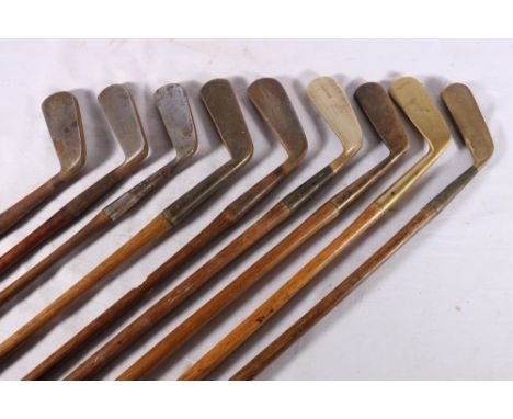 Nine hickory shafted golf clubs, all putters including R J Gibson of Calcutta Golf Club special accurate putter, Cairo wry ne