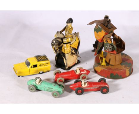 Mettoy style tinplate clockwork model of a drummer on horse back, a tinplate missile launcher and three Dinky racing cars 