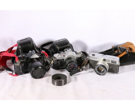 Canon A-1 camera with Canon zoom lens 35-70mm 1:3.5-4.5, Canon AV-1 camera with Canon lens 50mm 1:1.8 and Canon Canonet with 