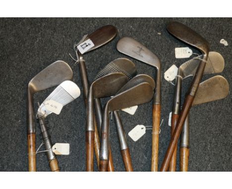 Eleven hickory shafted golf clubs including R Thomson of St Andrews left handed mashie niblick, Tom Morris of St Andrews Elec
