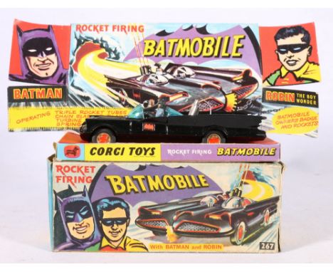 Corgi Toys 267 rocket firing Batmobile with Batman and Robin on pictorial diorama stand with packet containing spare missiles