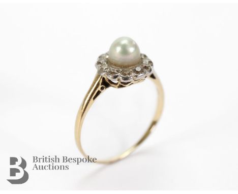 18ct yellow gold and platinum diamond and pearl ring. The pearl measures 4mm surrounded by approx 18 pts of dias, size K+, 1.