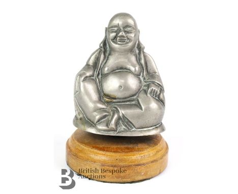 A nickel plated mascot by Desmo Motor Accessories of a Buddha, marked Desmo, mounted to a display base. -