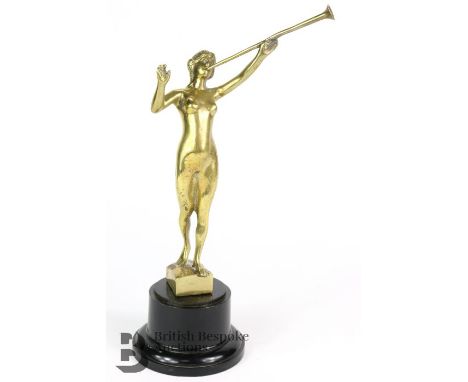 A brass Speed Nymph motorcar mascot featuring a feminine nude, playing a trumpet. approx. h 20 cms. 