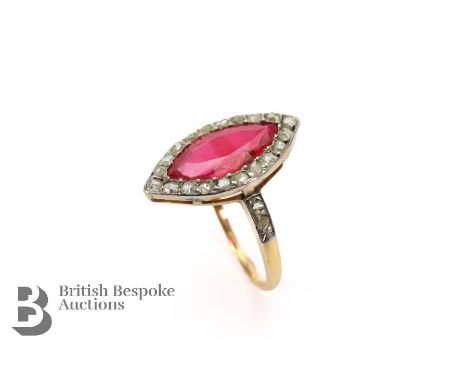 Vintage 18ct yellow gold and platinum synthetic ruby and diamond ring. The marquise-cut ruby measures 14 x 6mm, surrounded by