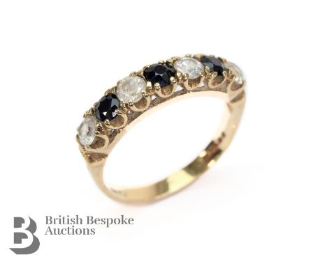 Lady's 9ct blue and white spinel ring. The ring set with three midnight-blue sapphire approx 3 x 3mm each, size M, approx 2.2