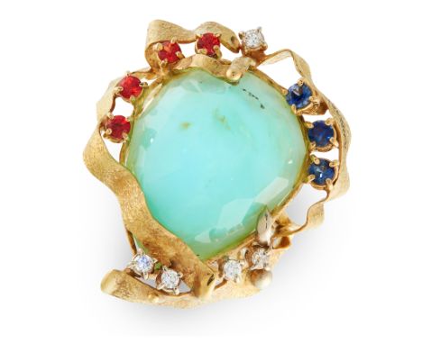 AN OPAL, RUBY, SAPPHIRE AND DIAMOND RING in 15ct yellow gold, in abstract design, set with a central faceted blue opal of 3cm