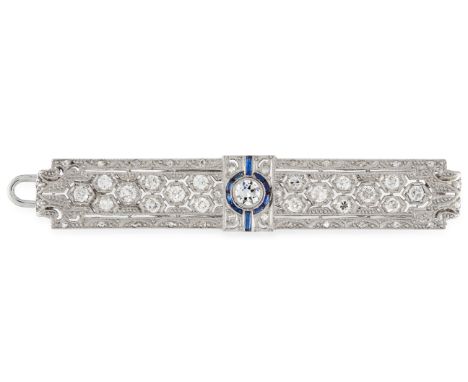 A DIAMOND AND SAPPHIRE BROOCH in pierced rectangular form, set with a central round cut diamonds in a circular border of step
