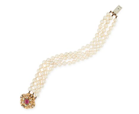 A PEARL RUBY AND DIAMOND BRACELET in 18ct white gold, comprising of three rows of pearls, jewelled with a clasp set with roun