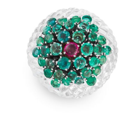 A CARVED ROCK CRYSTAL, EMERALD AND RUBY COCKTAIL RING in white gold, the carved rock crystal set with round cut emeralds and 