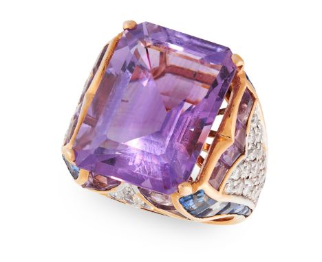 AN AMETHYST DIAMOND AND SAPPHIRE DRESS RING set with a central emerald cut amethyst of approximately 24 carats, round cut dia