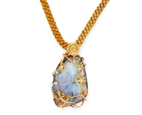 A BOULDER OPAL, RUBY AND DIAMOND NECKLACE set on a rope cord, comprising of a boulder opal of 5.5cm, encaged by a scrolling b