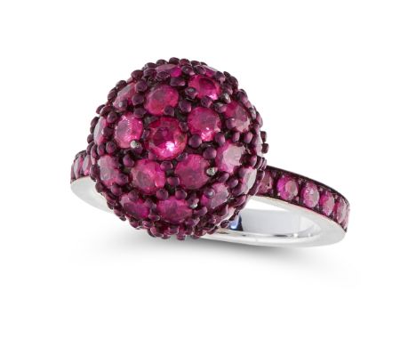 A RUBY DRESS RING designed as a ruby half eternity, with a central sphere set all over with round cut rubies totalling approx