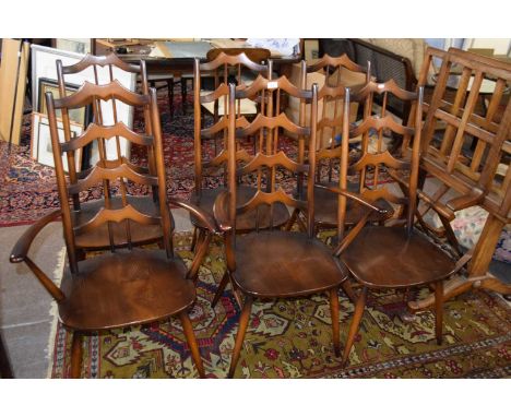 Unusual set of six Ercol stick and bar back dining chairs comprising two carvers and four standard chairs