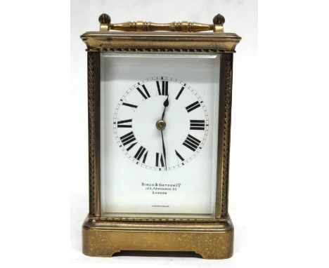 Brass carriage clock with white enamal dial, retailed by Birch &amp; Gaydon, London with French movement