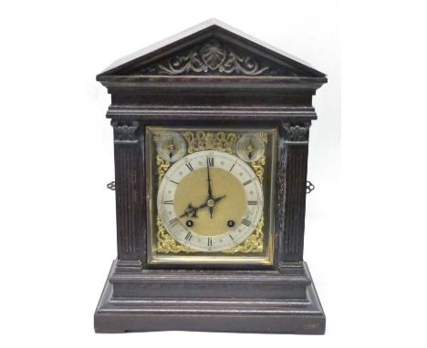 Mantel clock late 19th Century in oak case , with gilt spandrels and enamel dial