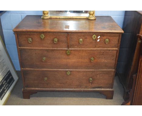 Georgian oak chest of two short and two long drawers raised on bracket feet fitted with ringlet handles, 109 cm wide