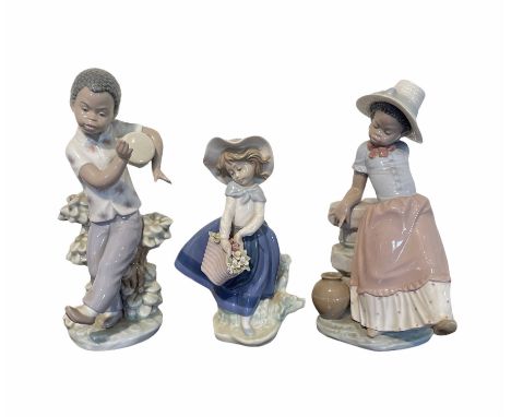 Pair of Lladro figures designed by Jose Roig 'Bongo Beat' No5157 and 'A Step in Time' No.5158 and a Lladro figure of a girl w