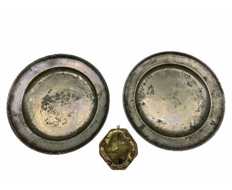 Gilt metal crest mounted on an oak panel, possibly the Bailey family W17cm and a pair of late 18th century pewter chargers D4