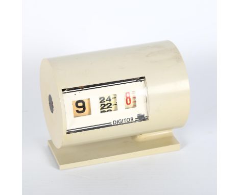A mid-century Digitor alarm clock, width 10cmsome paint chips to face, working order. 