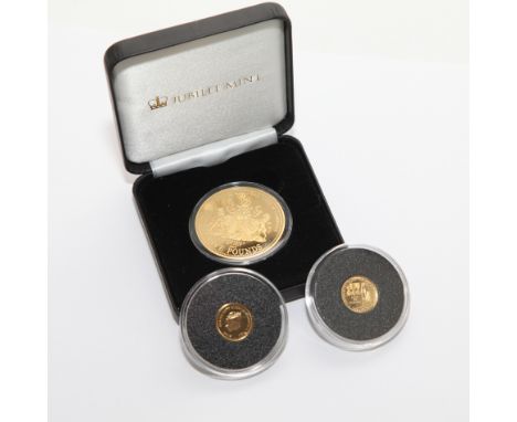 two 9ct gold coins commemorating the centenary of World War I, each 1 gram in weight, a Jubilee £5 coin commemorating first b