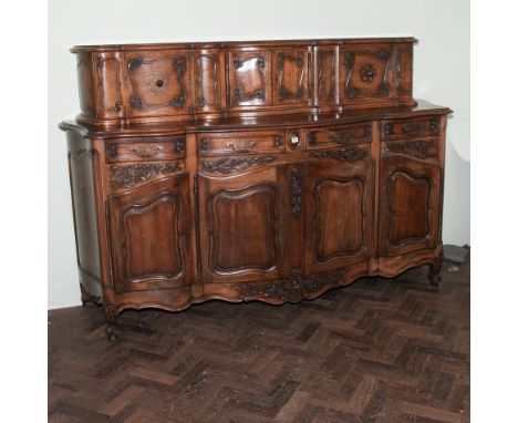 Large French walnut shaped front sideboard/buffet cabinet, the base fitted with 4 drawers above four cupboard doors with whea