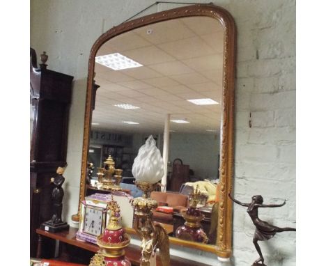 Late Victorian gilt arched over mantel mirror standing on white porcelain ball feet 52" high x 42" wide   Condition - general